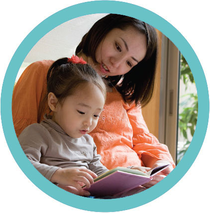 A woman reading to a child